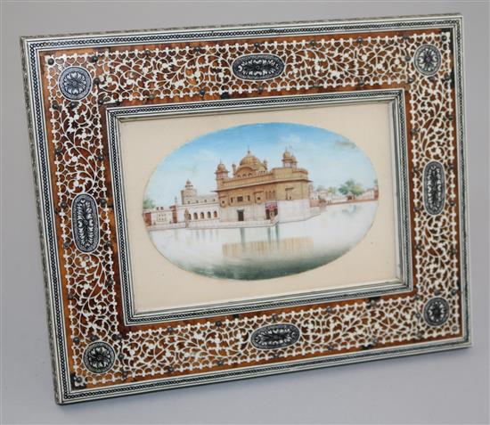 An early 20th century Indian ivory miniature of The Golden Temple, 3 x 4.75in. in ivory overlaid tortoiseshell frame 7 x 8.5in.